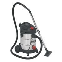 Sealey industrial vacuum cleaner, 30L stainless drum, black top, red accents, flexible hose, and sturdy wheels.