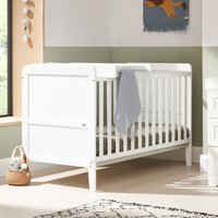 White Tutti Bambini Rio cot bed with slatted sides, integrated changer, and striped mattress in a nursery setting.