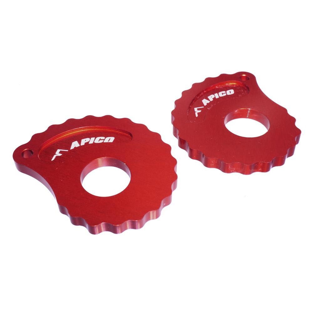 Red anodized aluminum snail cams with a scalloped edge and a central hole, featuring the "APICO" logo prominently displayed in white.