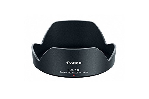 Black Canon EW-73C lens hood with a curved design, featuring a matte finish and embossed branding, designed to reduce lens flare and improve image quality.