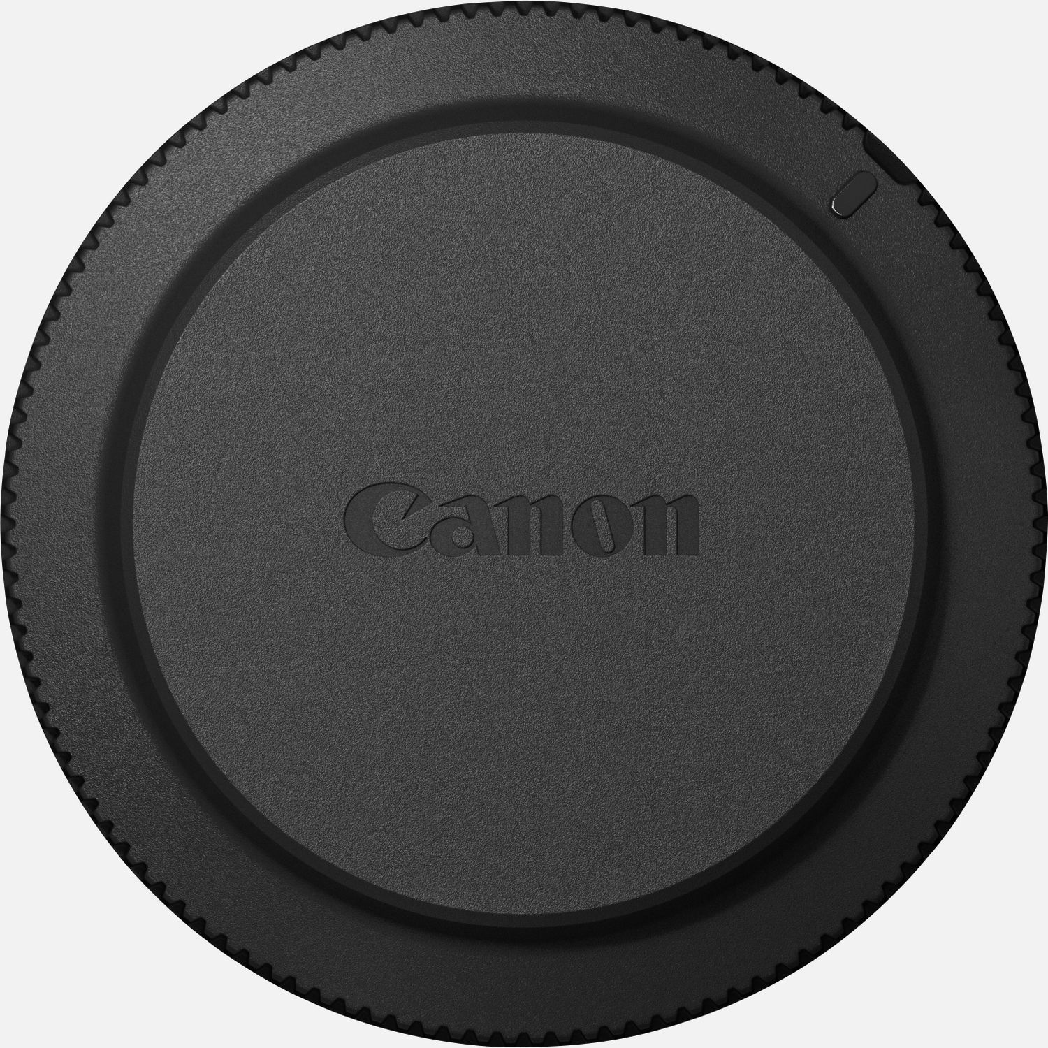Round black lens extender cap with a textured edge and embossed "Canon" logo in the center, designed for RF mount lenses.