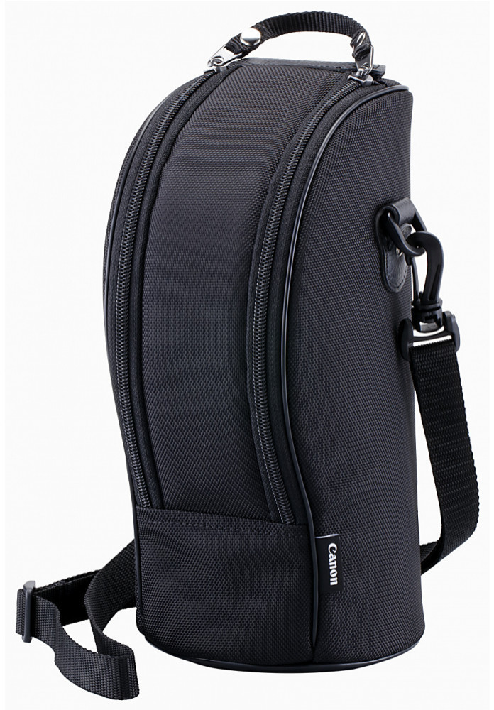 Black soft lens case by Canon, featuring a durable exterior, dual zippered compartments, a sturdy handle, and an adjustable shoulder strap for easy carrying.