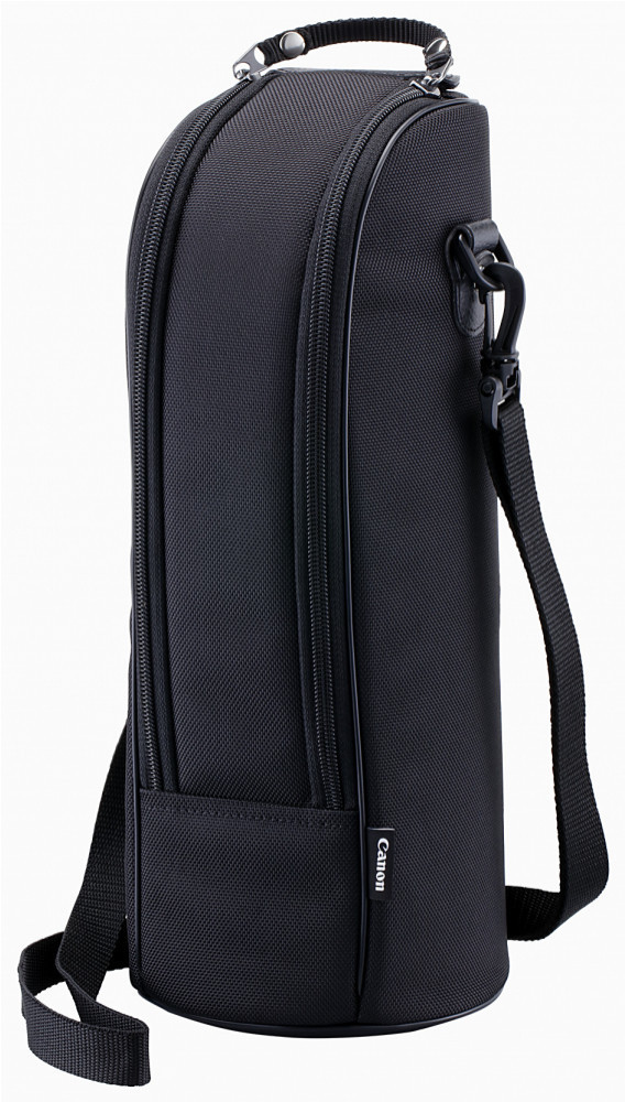 Black soft lens case with a textured exterior, featuring a zippered closure, adjustable shoulder strap, and a front pocket, designed for Canon lenses.