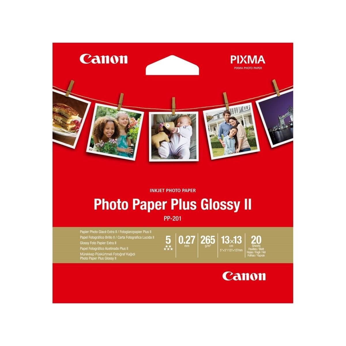 Red packaging featuring the Canon logo, labeled "Photo Paper Plus Glossy II," with a 5x5 inch size and 20 sheets, showcasing sample photos along the top.