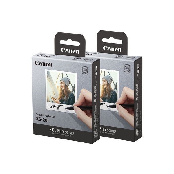 Canon XS-20L square photo paper pack for QX10 printer, featuring a gray box with a smiling woman holding a photo, labeled "Love you!" and includes two sets of 2.7" x 2.7" paper.