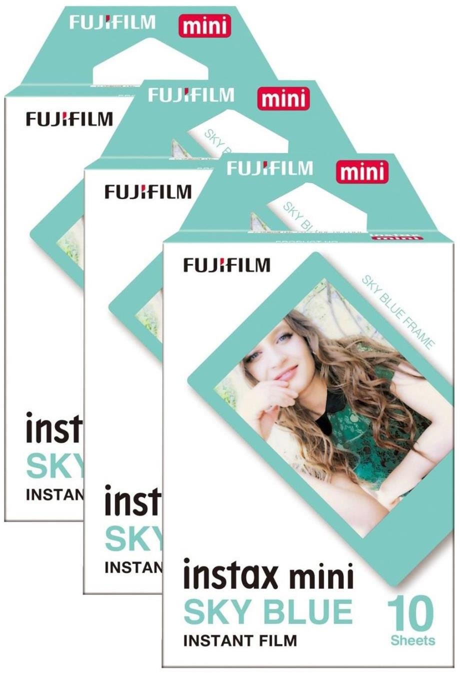 Fujifilm Instax Mini instant photo film packs in sky blue, featuring three packs of 10 sheets each, with a playful design and a clear frame for vibrant instant photos.