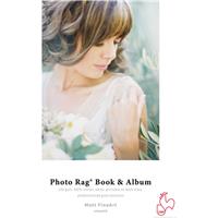 White cover featuring "Photo Rag® Book & Album" text, with a soft-focus image of a woman surrounded by greenery, showcasing a textured, high-quality paper finish.