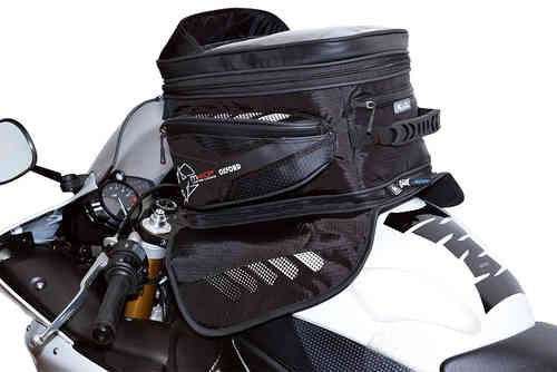 Black Oxford OL205 tank bag with multiple zippered compartments, mesh pockets, and a padded top, designed for motorcycle use, mounted on a bike's tank.