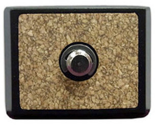 Black and silver tripod head plate with a textured cork surface, featuring a central mounting screw for secure attachment to cameras.