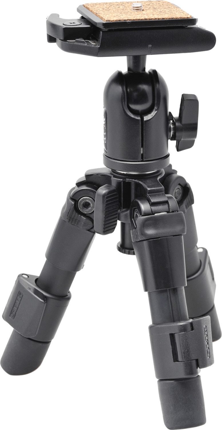 Compact black tripod with three adjustable legs, a quick-release plate, and a sturdy head for digital and film cameras, designed for portability and stability.
