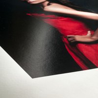 Hahnemühle FineArt Baryta Satin paper, smooth white surface, featuring a vivid red dress print detail.