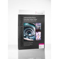 Hahnemühle Photo Matt Fibre Duo 210 A3+ paper, white, in a black and white box with colorful sample images.