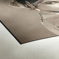 Hahnemühle Photo Rag White paper with a smooth matte finish, displaying a sepia-toned portrait on the surface.