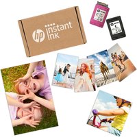 HP Advanced Photo Paper Glossy pack with colorful printed photos and HP ink cartridges nearby.