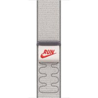 Veiled grey Apple 42mm Nike Sport Loop with red "RUN" logo, breathable woven fabric, and adjustable hook-and-loop fastener.
