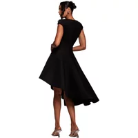 Black asymmetrical skater dress with textured fabric, cap sleeves, and high-low hem by Goddiva.