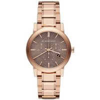 Rose gold-tone Burberry ladies watch with a round brown dial, date display, and link bracelet.