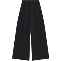 Black cotton flared trousers with elastic waistband and subtle Diadora logo on the side.