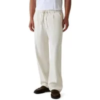 Cream cotton trousers by Guess Paolo Owen with drawstring waist, relaxed fit, and side pockets.