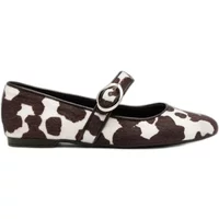 Cow print ballet flats with a black and white pattern, featuring a strap and buckle by Ryłko Judie.