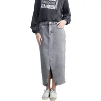 Gray denim maxi skirt with front slit, worn with a black graphic sweatshirt and white sneakers.