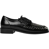 Black patent leather derby shoe with lace-up front and studded detailing on the toe cap.