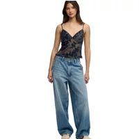Black flocked mesh cami top with floral pattern, spaghetti straps, and scalloped hem.