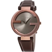Gucci ladies watch with brown dial, interlocking G bezel, and brown leather strap.