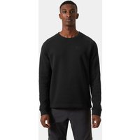 Black Helly Hansen crewneck sweater, long sleeves, subtle logo on chest, worn by male model, size S.