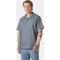 Navy Helly Hansen short sleeve shirt, button-up with subtle pattern, worn by a model, size M.