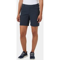 Navy Helly Hansen women's deck shorts with front pockets and button closure, worn with navy sneakers.