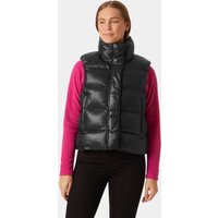 Black Helly Hansen women's puffer vest with high collar and front zipper, worn over a pink long-sleeve shirt.