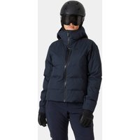Navy Helly Hansen women's puffy ski jacket with hood, full zip, and insulated design, worn by model with helmet.