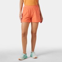 Orange Helly Hansen women's shorts, 4-inch length, elastic waistband, lightweight fabric, worn by model with teal shoes.