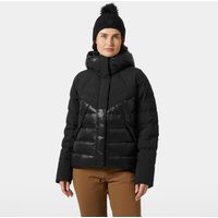 Black Helly Hansen women's down jacket with hood, quilted design, and front zipper, worn by model with brown pants.