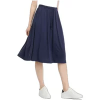 Navy blue Ragwear Reikko skirt with elastic waistband and side pockets, worn with white sneakers.