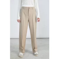 Beige fluid cut trousers with light print, high waist, button closure, and wide legs worn by a model in white top.
