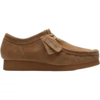 Brown Clarks Wallabee EVO loafers with suede finish, moccasin-style stitching, and crepe sole.
