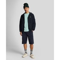Dark navy men's chino shorts with side pockets, belt loops, and button closure, worn by a model with casual attire.