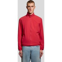 Red Lyle & Scott men's windbreaker jacket with zip front, high collar, and adjustable cuffs.