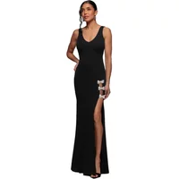 Black mermaid maxi dress with rhinestone brooch, sleeveless, V-neck, thigh-high slit by Goddiva.