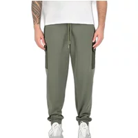 Olive green nylon cargo joggers by Alpha Industries with side pockets, elastic cuffs, and drawstring waist.