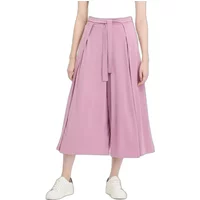 Pink Ragwear Rozalia women's culottes with wide legs, high waist, and a matching fabric belt, paired with white sneakers.