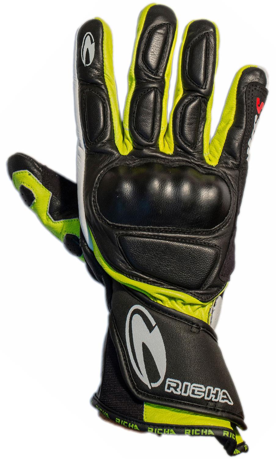 Black, white, and yellow motorcycle glove with protective padding, Richa logo, and adjustable wrist strap.