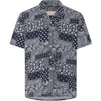 Navy short-sleeve shirt with intricate white paisley and polka dot patterns, button-down front, and classic collar.