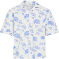White short-sleeve shirt with blue floral pattern and a classic collar.