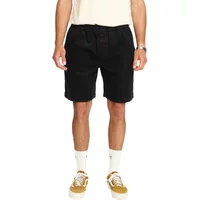 Black "Short long Revolution" shorts with elastic waistband, drawstring, and side pockets, worn by a model.