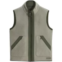 Sleeveless fleece Aigle T-Kit vest, light gray with olive green zipper and pocket trim, high collar.