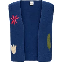 Blue sleeveless jacket for women by Ichi with floral embroidery in red, white, and green.