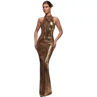 Gold sparkly backless maxi bodycon dress with halter neck and floral detail by Goddiva.